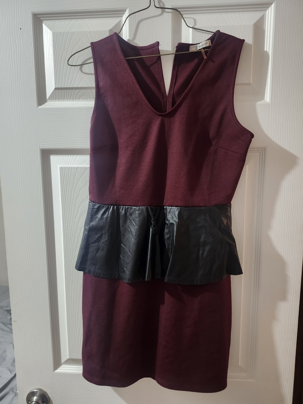 Freebirds Sleeveless Burgundy Peplum Dress with Black Faux Leather Trim